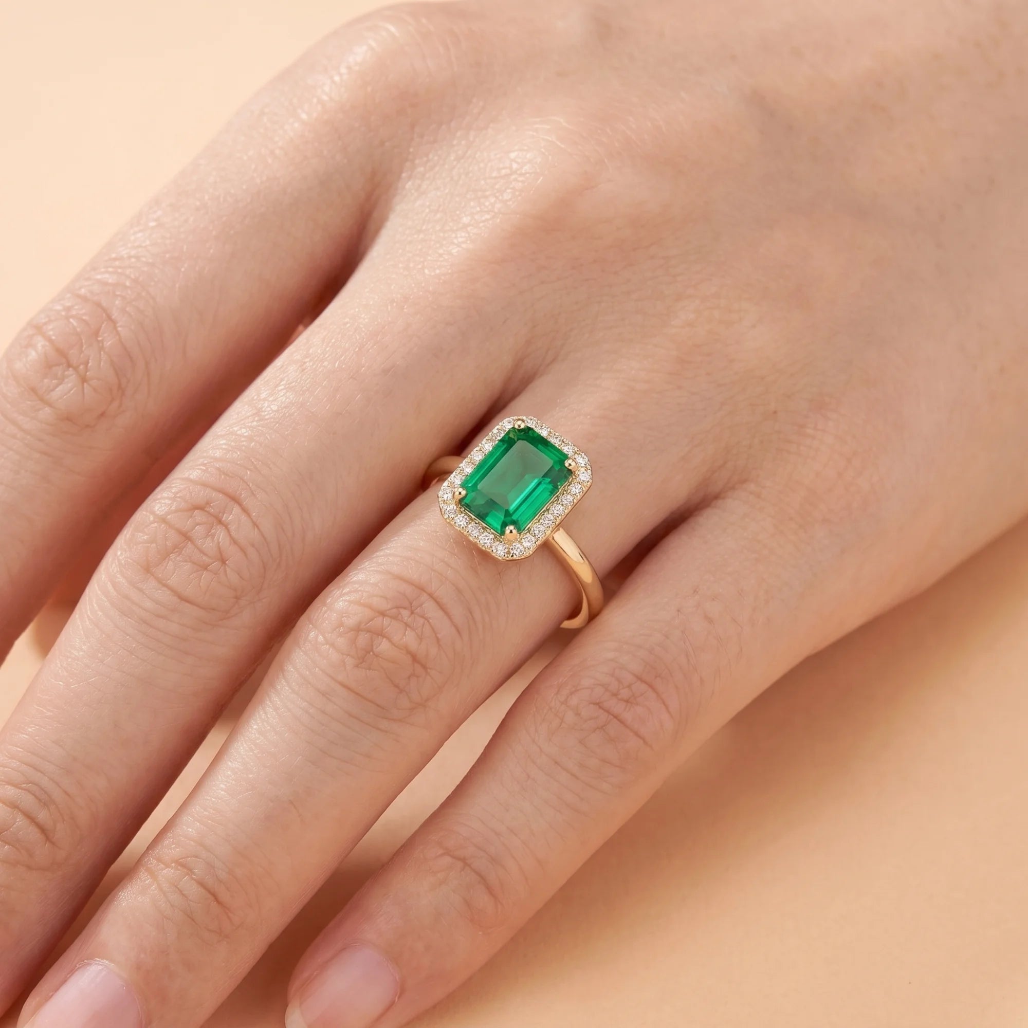 Emerald Halo Gold Promise Ring on Girls Hand