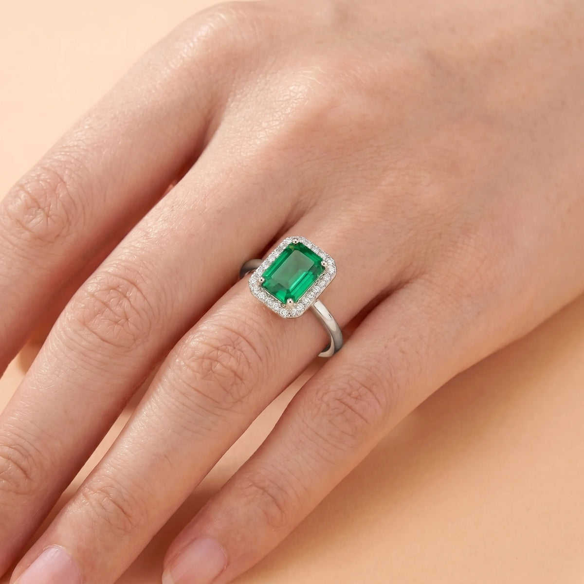 Emerald Halo Silver Promise Ring on Girls Hand